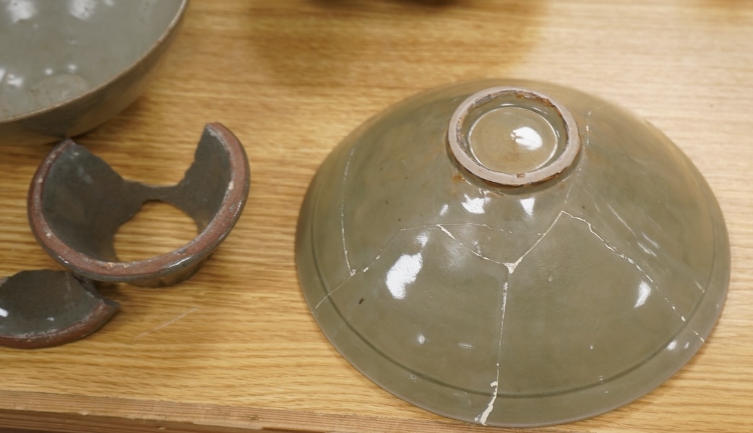 Five pieces of Chinese/Korean celadon comprising three bowls and two vases, 31cm high. Condition - some breaks